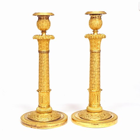 A pair of Louis XVI gilt candle sticks. Paris 
circa 1800. H: 33cm