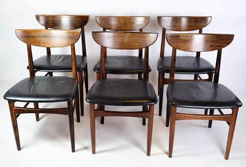 A set of six dining table chairs of Danish design in rosewood with black leather 
from around the 1960s.
Great condition
