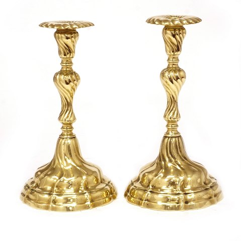 Pair of Rococo brass candlesticks. Circa 1760. H: 
23cm