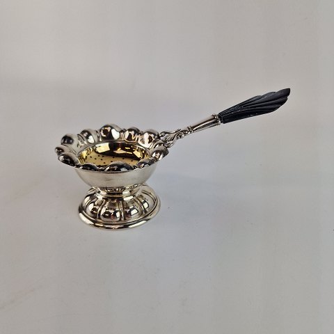 Cohr te si 
med holder i sølv
