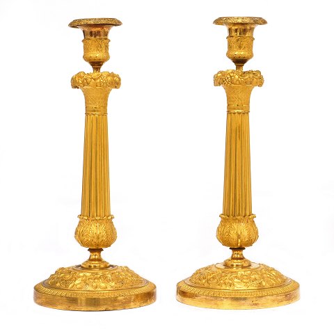 Pair of early 19th century French firegilt bronze 
candlesticks. France circa 1810-20. H: 31cm
