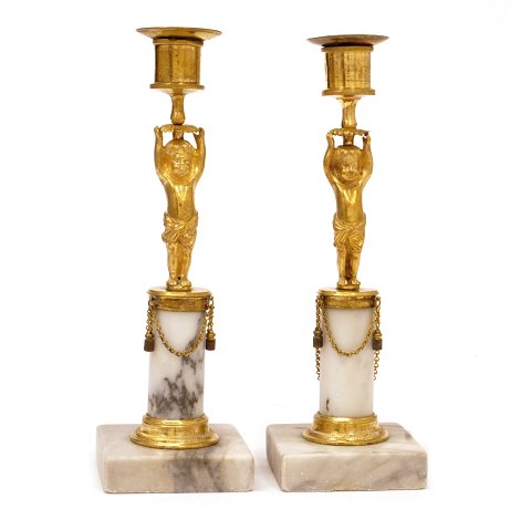 A pair og gilt early 19th century bronce 
candlesticks. France circa 1810. H: 24cm