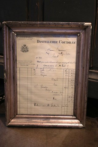 Old French handwritten liquor bill framed in an old silver frame with patina...