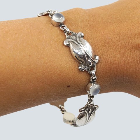 Georg Jensen; A "Moonlight Blossom" bracelet of sterling silver, set with moonstone, No. 11