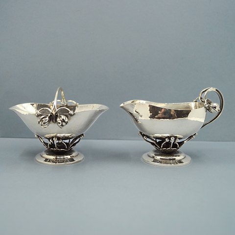 Georg Jensen; A set with sugar bowl and creamer of sterling silver, No 235 A