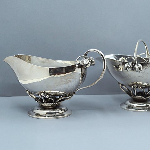 Georg Jensen; A set with sugar bowl and creamer of sterling silver, No 235 B