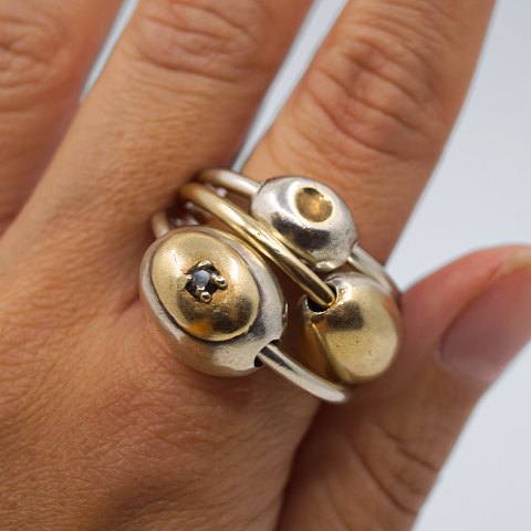 Anette Kræn; Set of three rings made of silver with gold