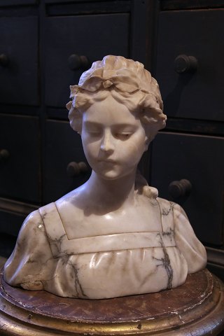Decorative French 19th century bust of a young woman 
in carved solid marble...
