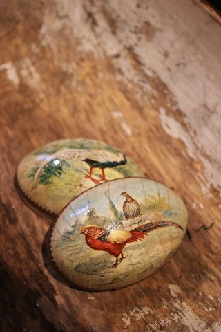 Old wooden Easter egg with painted peacocks from the early 1900s, dated inside 1904...