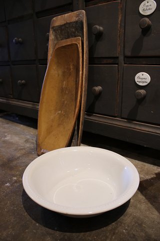 Old cream-colored earthenware bowl with pearl rim from Aluminia...