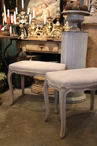Old rococo stool in wood with a fine gray patinated color and seat upholstered in linen...