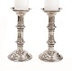 A pair of mid 18th century Baroque church candlesticks with the engraving "Sankt 
Paulus 1761". H: 28cm. F D: 14cm
