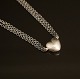 Ole Lynggaard, Denmark: Sterlingsilver necklace with 18kt gold Heart clasp. L: 39cm