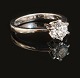 A 14kt gold solitaire ring with a brilliant cut diamond of 1,01ct. Ringsize 57. With grading report