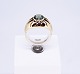 Ring of 14 ct. gold and decorated with a light green jemstone, stamped Ib&W.5000m2 showroom.
