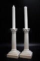A pair of rare old Royal Copenhagen column candlesticks in white porcelain with Juliane Marie brand. H:22cm.
