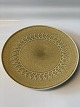Relief stoneware, round dish on a low foot.
Measures 26.7 cm