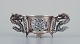 Chinese silver, small decorative item with dragon motifs in the decoration. Resting on four feet.