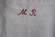 An old bag made of antique flax, with embroidery made by hand with a red signature "MR" This bag is a beautiful way to have your  laundry65cm x 37cmIn a very good condition