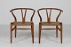 Hans J. Wegner
Wishbone chairs CH 24 
of oak with patina