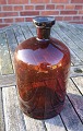 Large and well-maintained 5 liter apothecary 
bottle in dark brown glass.