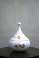 Small Rosenthal Bjorn Wiinblad lidded jar in white porcelain with gold 
decorations...