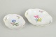 Meissen, set of two dishes with polychrome flower decoration.