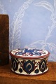Royal Copenhagen bonbonniere designed by Berte Jessen in blue and red-violet pattern...