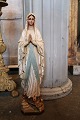 Decorative, old French Madonna figurine with glass eyes in painted plaster with fine patina...