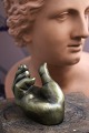 Decorative old hand in solid bronze...