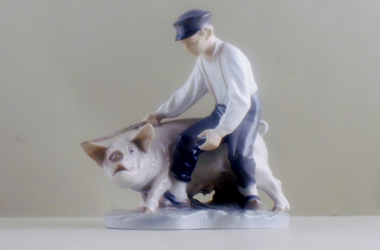 Rare Royal Copenhagen figurine, farmer with pig. Decoration number 848.