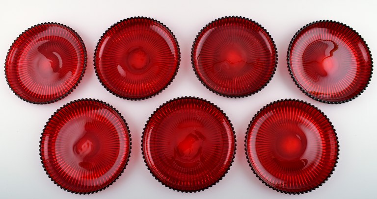 7 plates in red glass, designed Josef Frank.Produced by: Reijmyre / Gullaskruf.