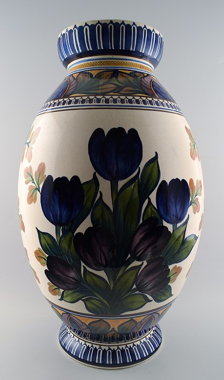 Aluminia faience monumental vase, hand painted with floral motifs.