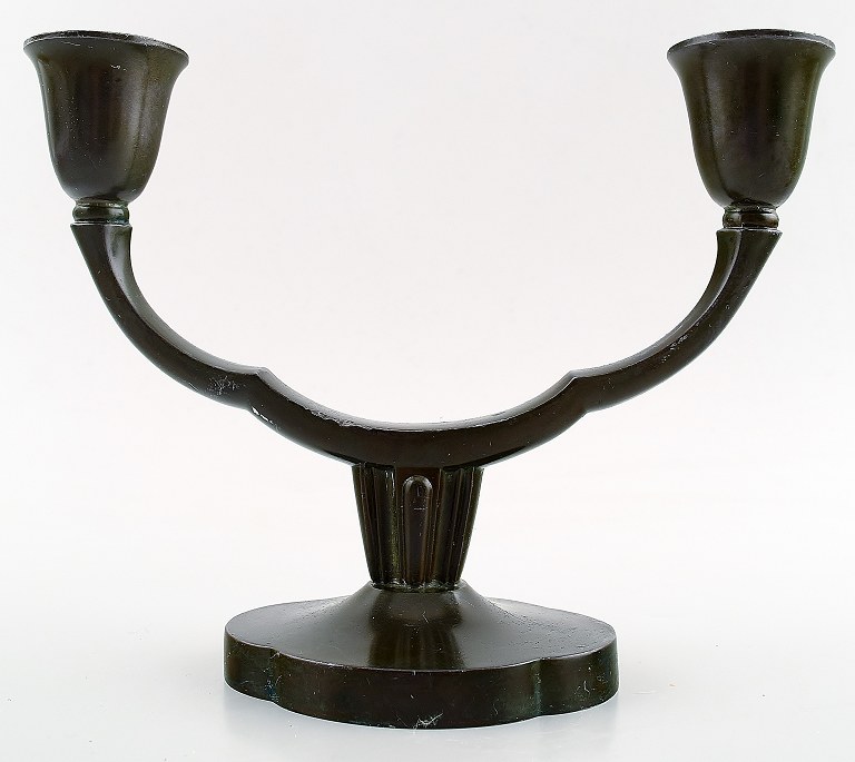 Just Andersen candlestick in patinated metal.