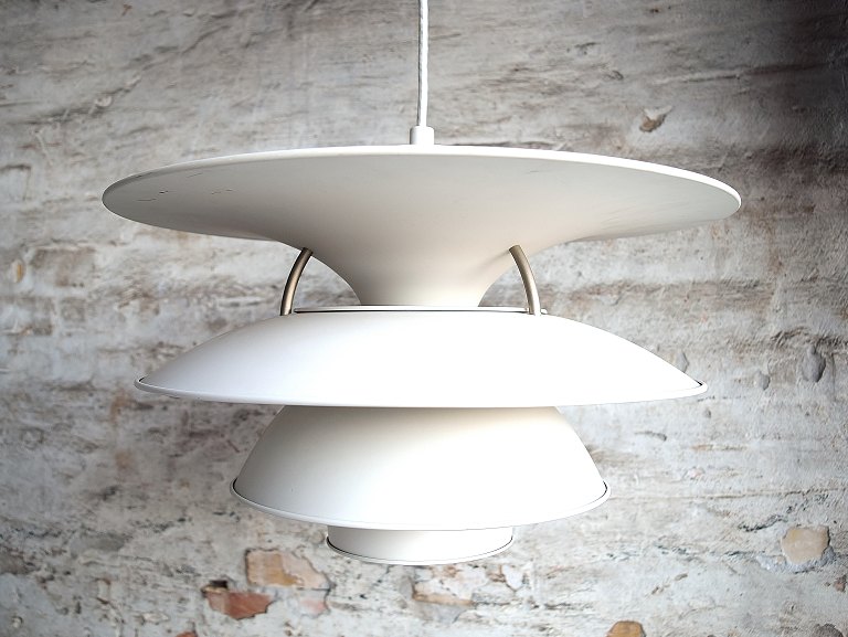 Poul Henningsen 1894-1967. Charlottenborg pendant lamp with four shades of white painted metal.