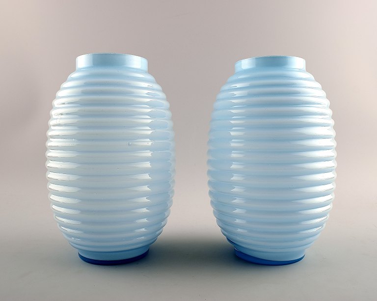 A pair of French Art Deco art glass vases in turquoise opaline glass.