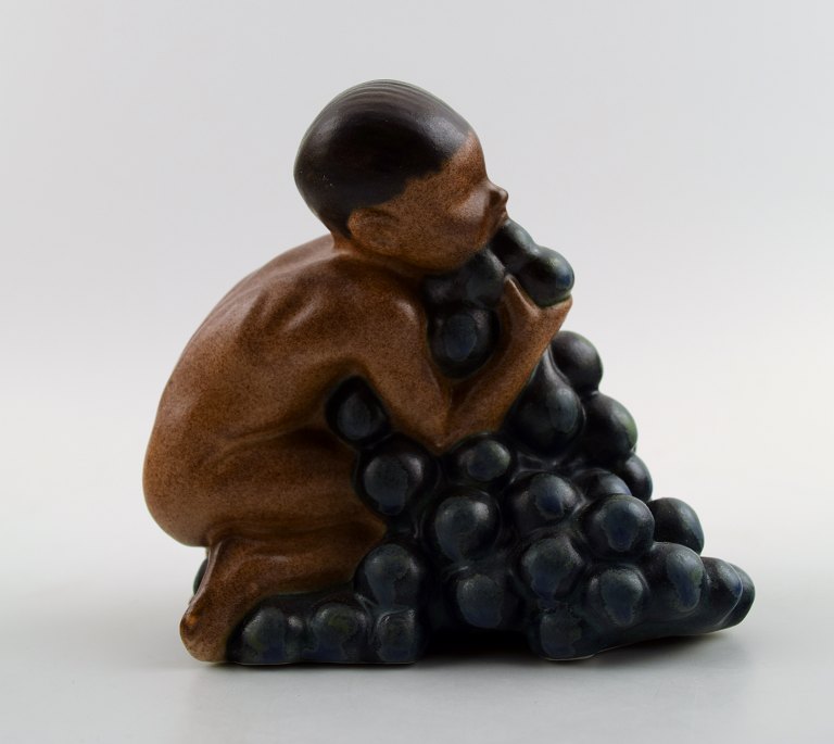 Bing & Grondahl, stoneware figurine of boy with bunch of grapes by Kai Nielsen.Model number 4021. From the series 