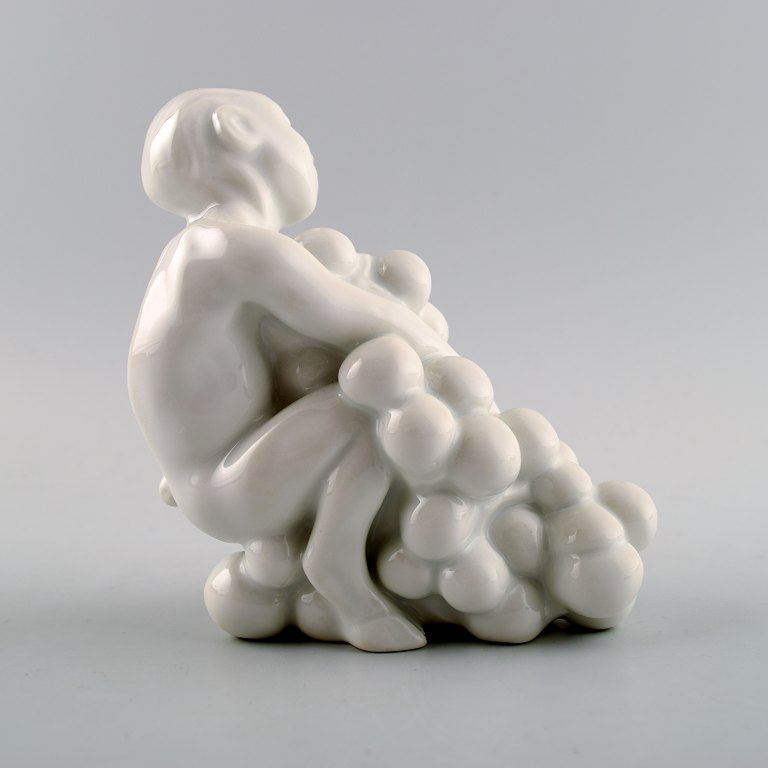 Bing & Grøndahl/ B&G, blanc de chine porcelænsfigur af faun med druer af Kai Nielsen. Fra serien 