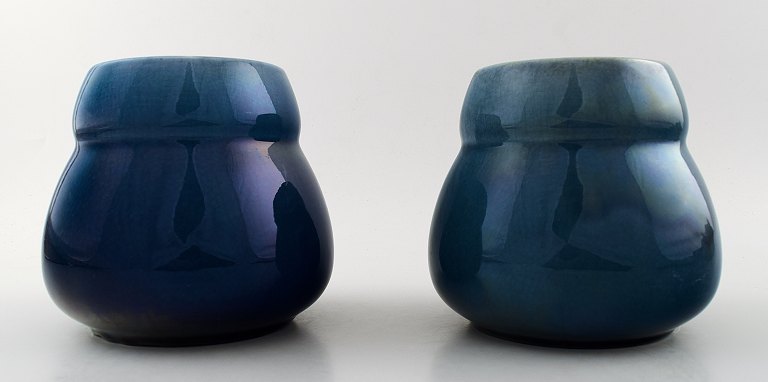 A pair of Rörstrand Art deco lidded vases in dark blue faience.