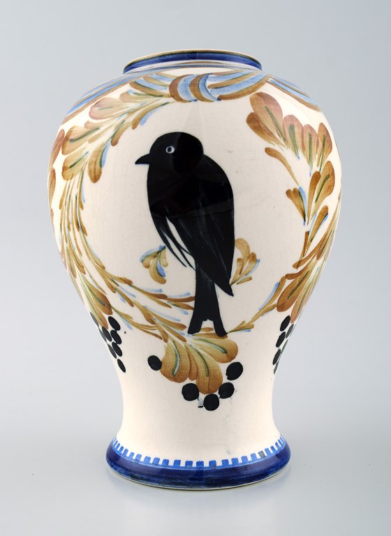 Aluminia faience vase, bird motif.Measures 18 x 13 cm.