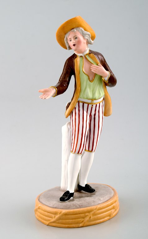 Royal Copenhagen overglaze figurine of gentleman in striped pants. Approximately 1860.