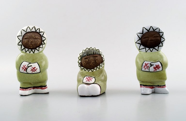 Collection of Upsala-Ekeby art pottery figurines, Eskimo children.