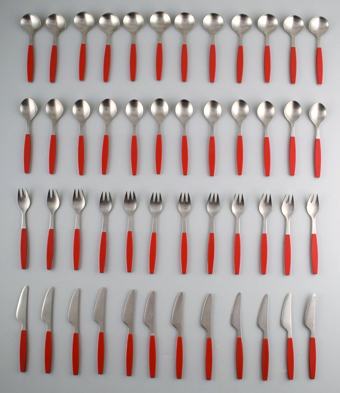 Complete service for 12 p., Henning Koppel. Strata cutlery made of stainless steel and red plastic. Produced by Georg Jensen.