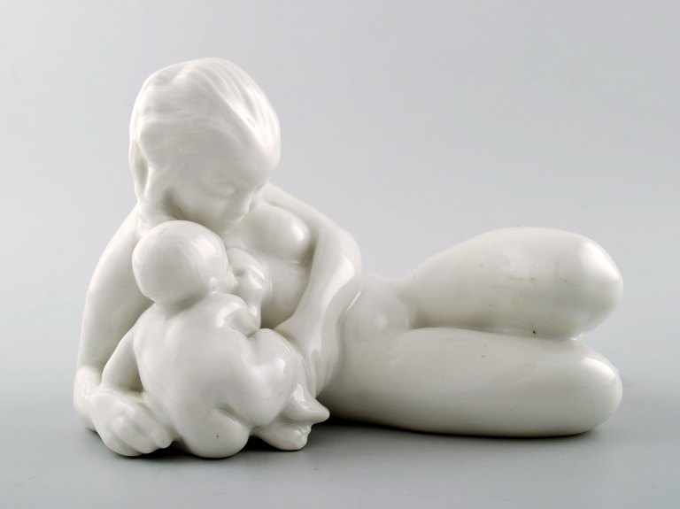 Rare Bing & Grondahl / B & G, blanc de chine porcelain figure of a young nude woman with child and fish by Kai Nielsen.