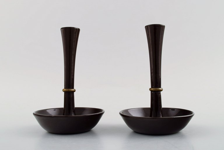 Jens H. Quistgaard, a pair of candlesticks in cast iron.Danish design 1960s.