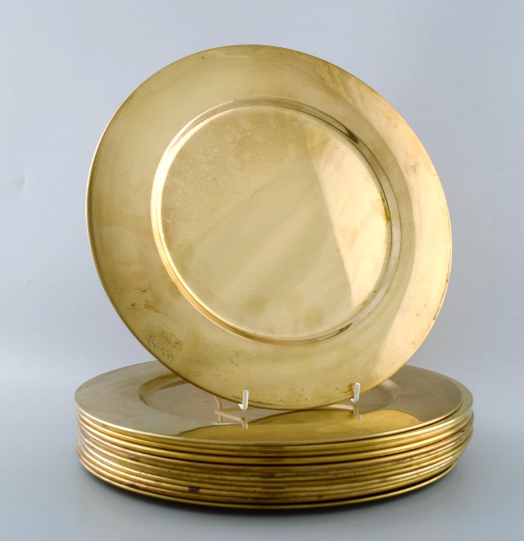 Set of twelve cover plates in brass.Danish design 60s.