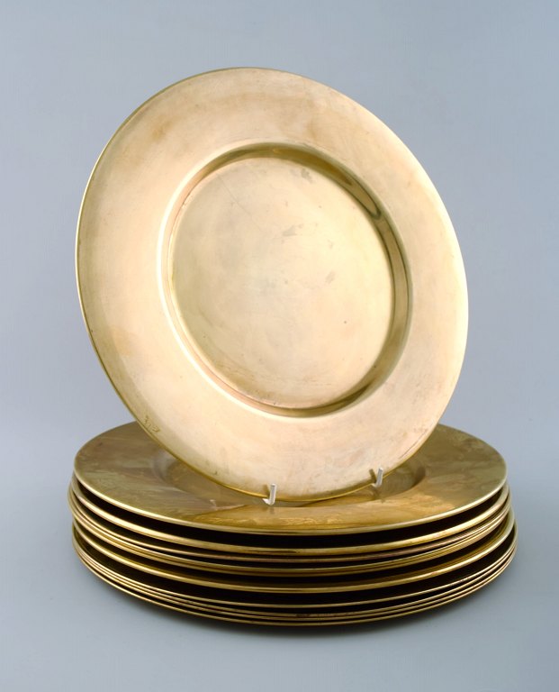Set of twelve cover plates in brass.Danish design 60s.