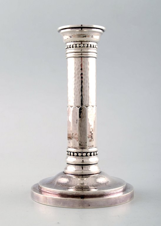 Johan Rohde: Candlestick of hammered sterling silver on round foot.