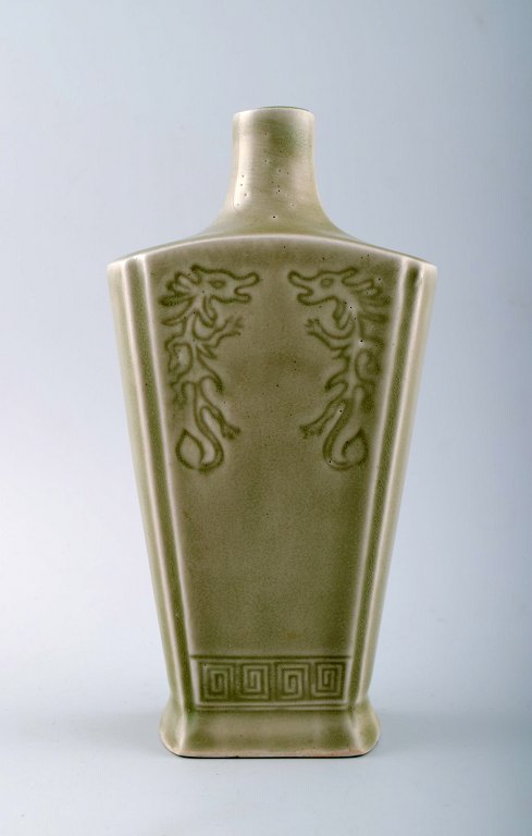 Chinese ceramic vase in celadon glaze with dragon motifs.