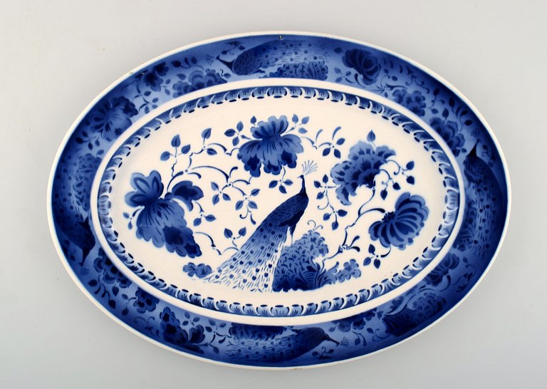 Peacock from Copenhagen faience / Aluminia.Large oval platter in earthenware.